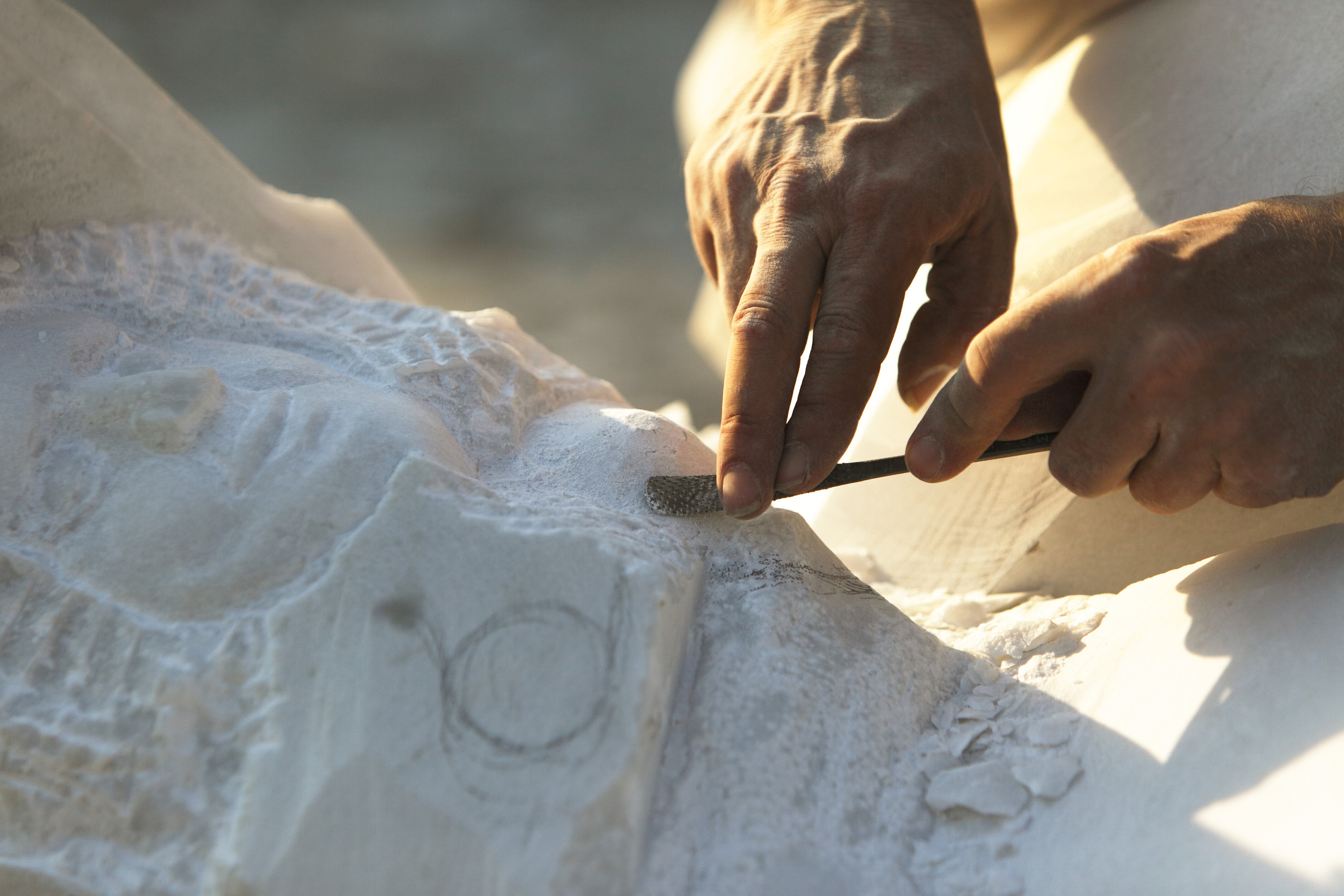 Stonemason processing marble in the Dolomites