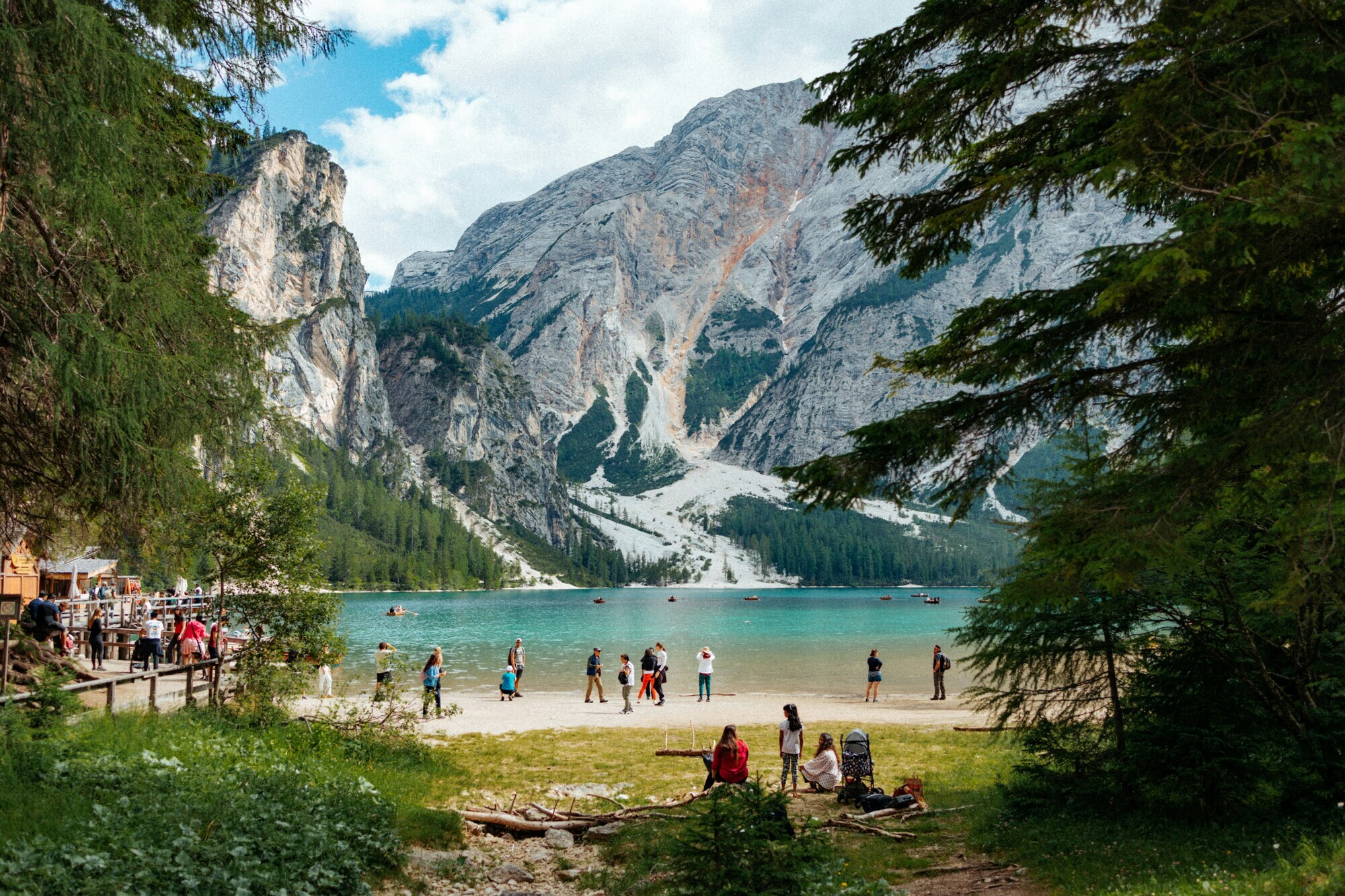 View of people on the shore of a beautiful mountain lake