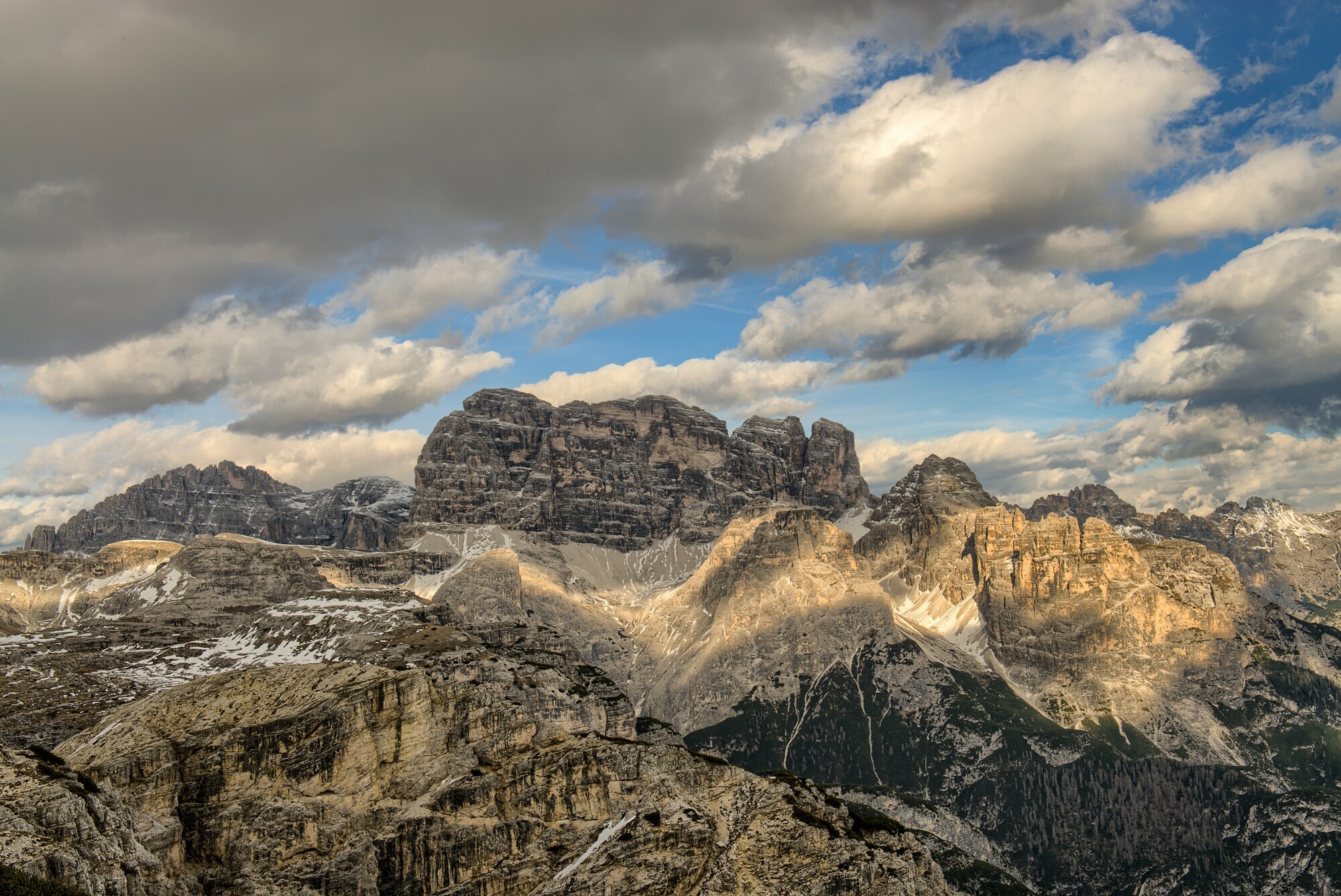 Landscape of rugged peaks with cloudy sky