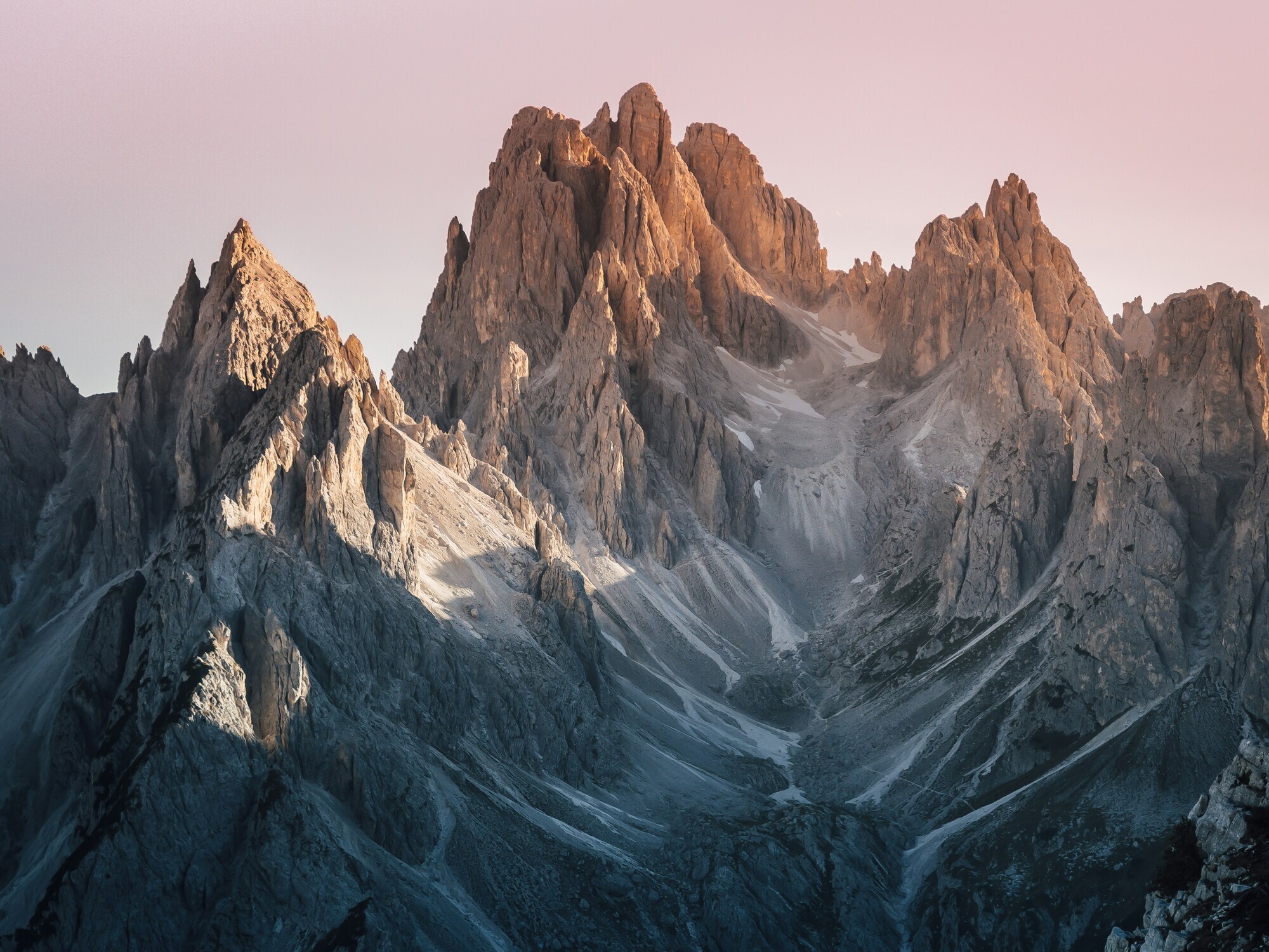 Rugged mountain peaks illuminated by the sun in the evening