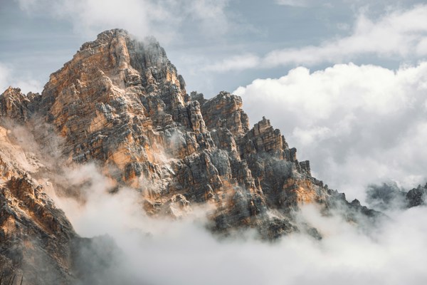 Rugged mountain peak, shrouded in clouds