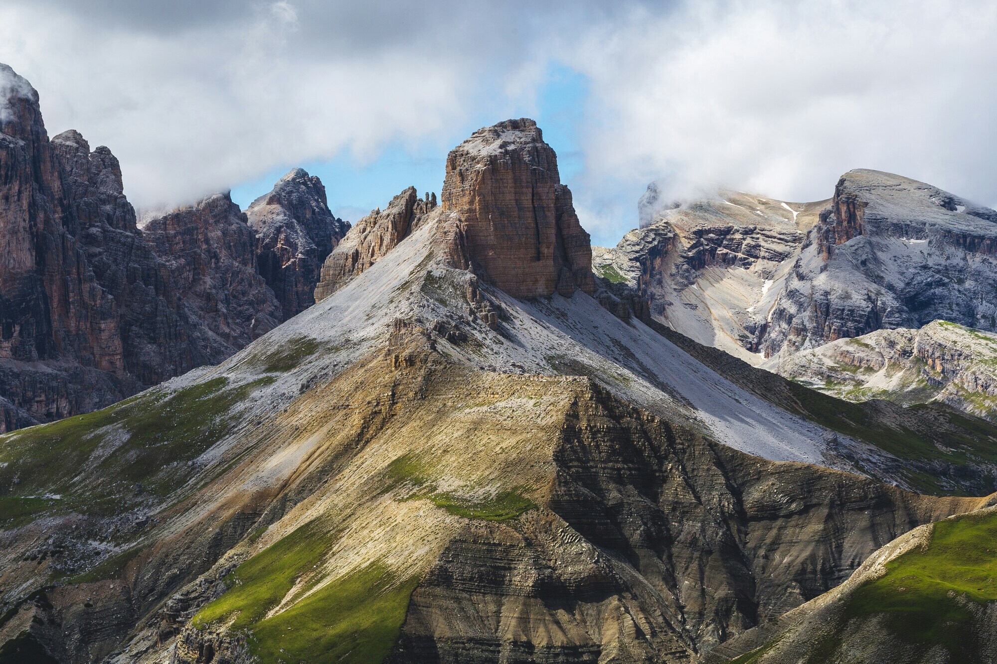 Bizarre formation of grey rock faces, layers of rock and steep slopes