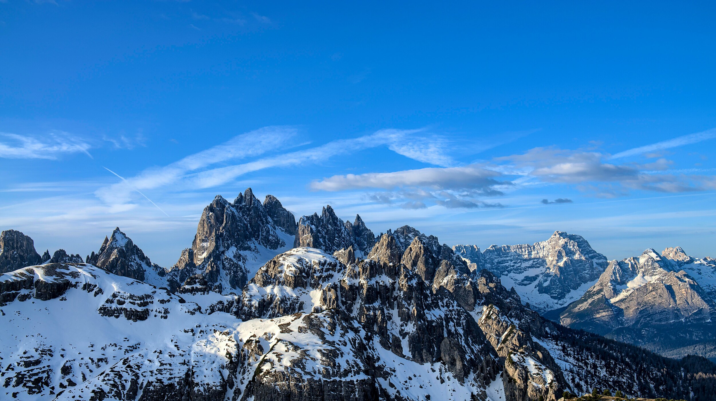 Rugged Dolomites peaks covered in snow