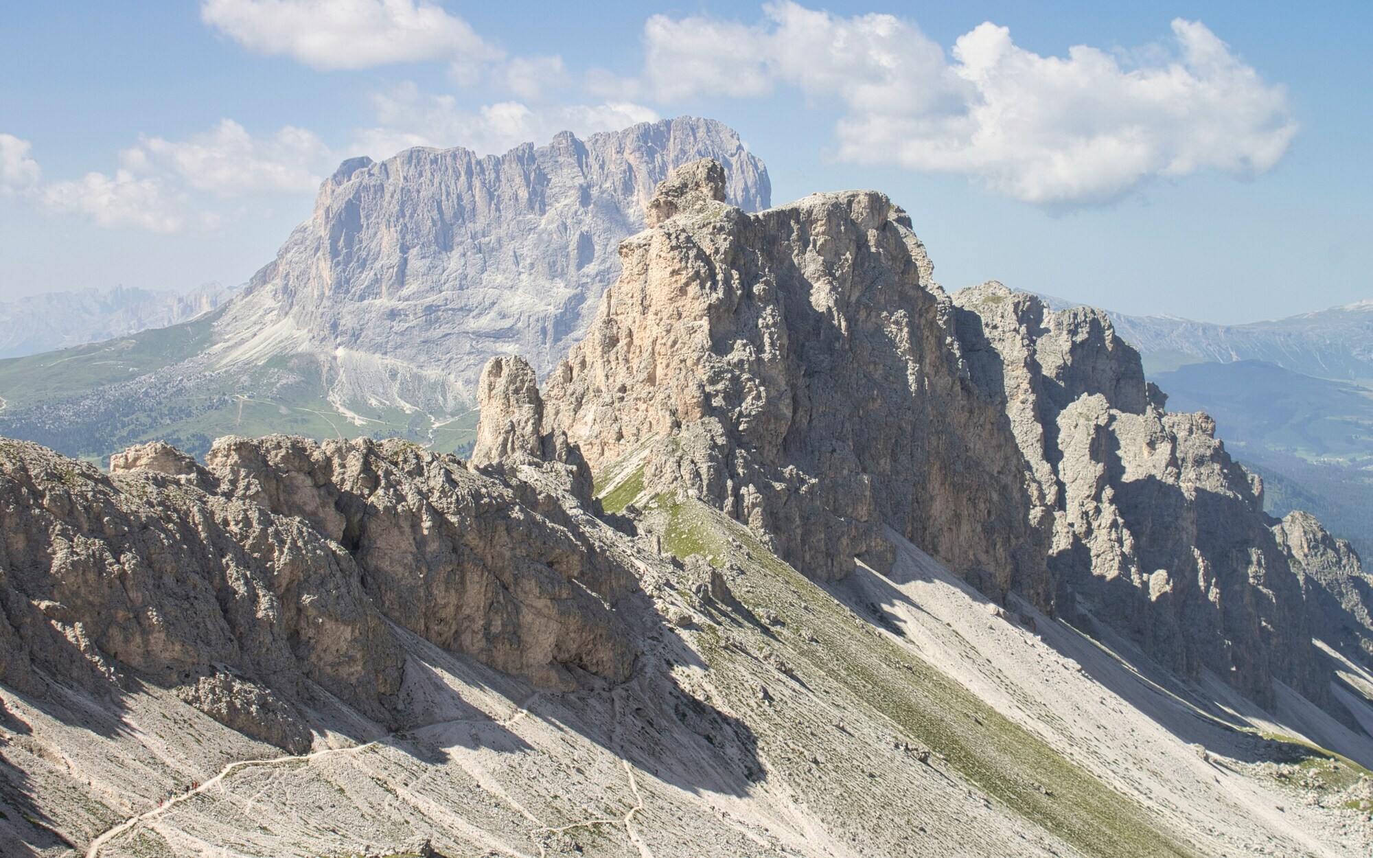 Rugged peaks and hiking path on a rocky slope