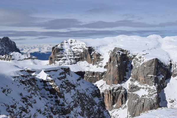 Snow-covered mountains and rock walls