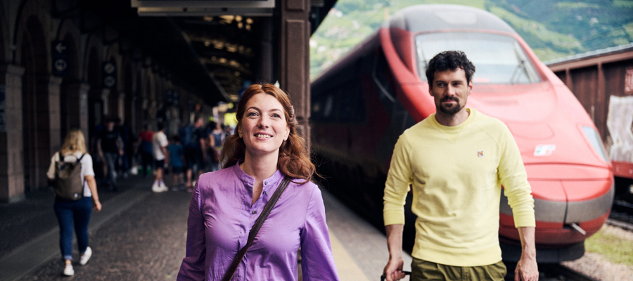 Couple with suitcases at the train station