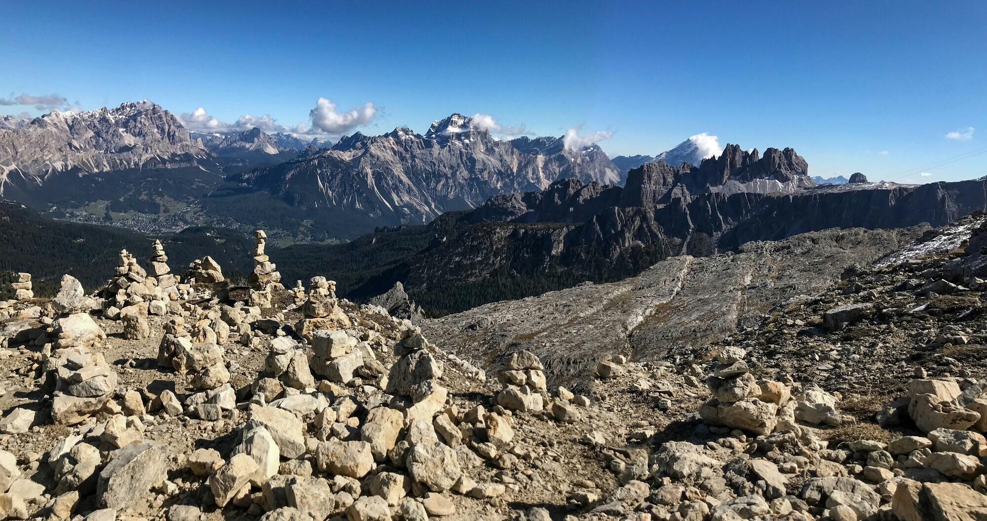 Stone cairns and clear blue sky with mountain view