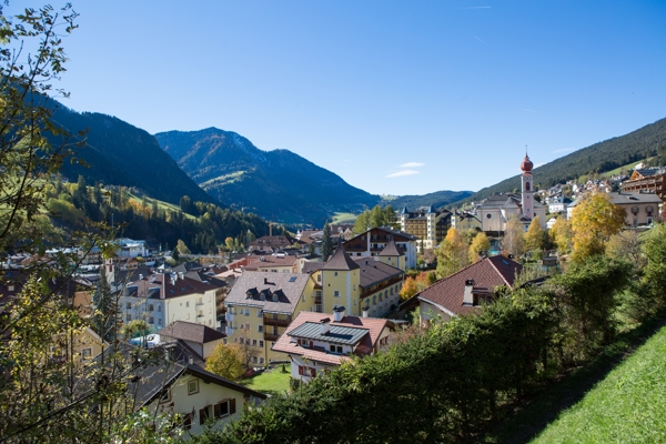 Village with church and golden-coloured trees