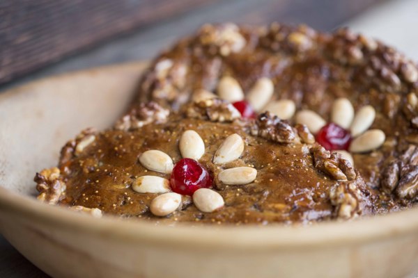 Sweet bread covered with honey, almonds and cherries