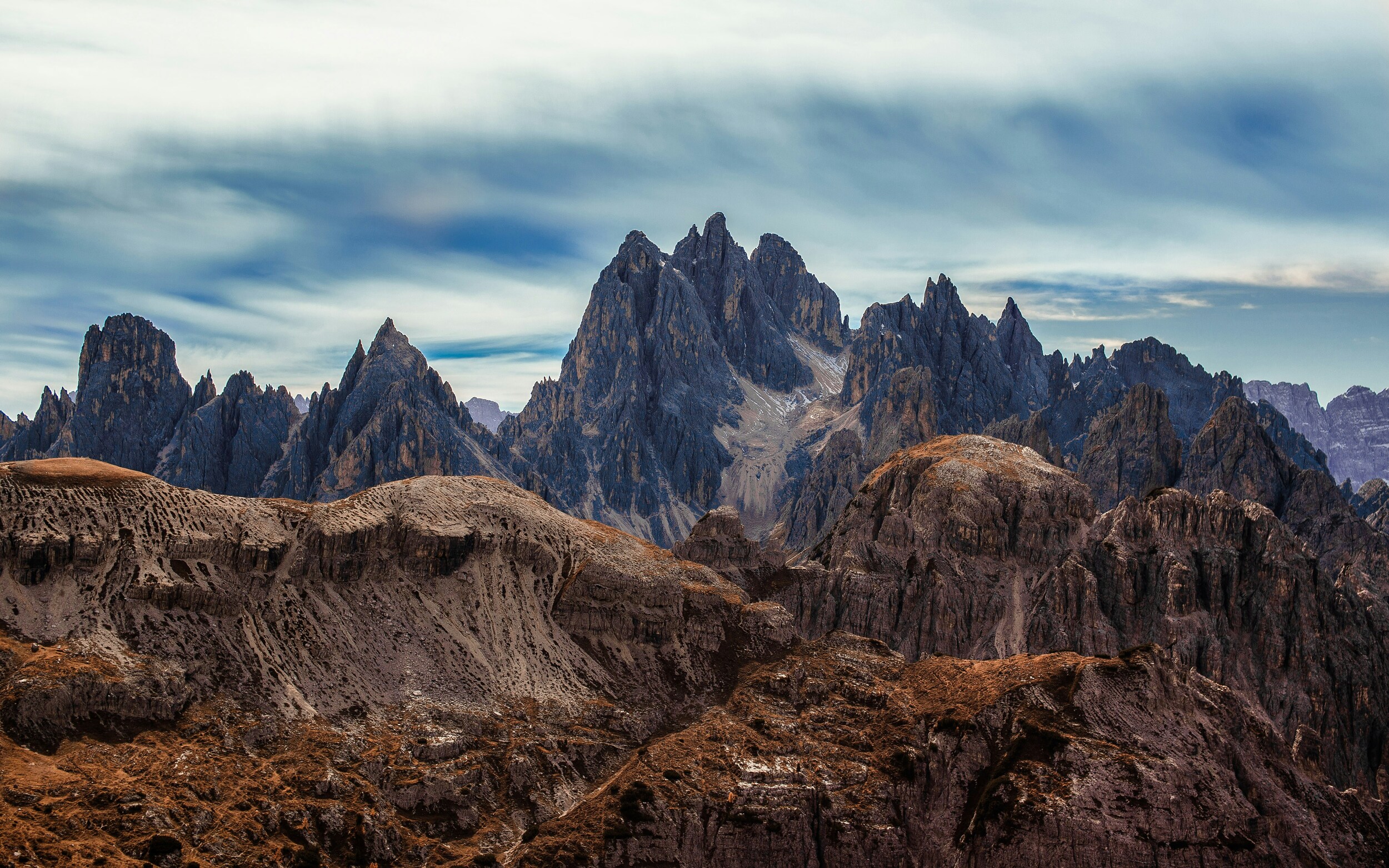 Rugged mountain peaks and grass-covered hills