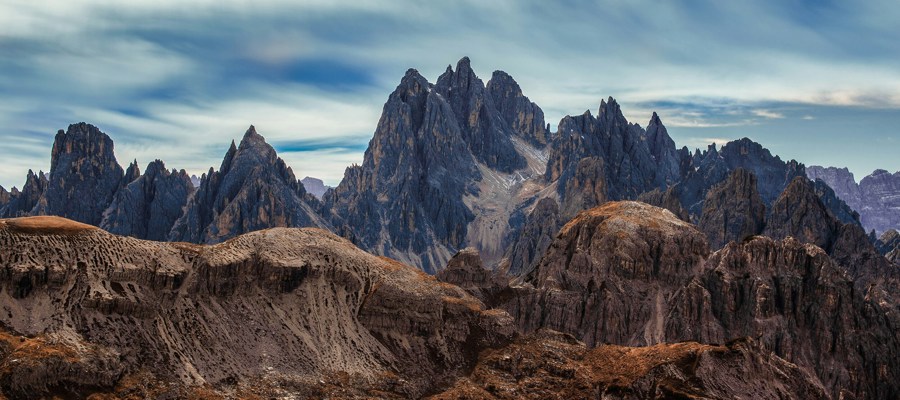 Rugged mountain peaks and grass-covered hills