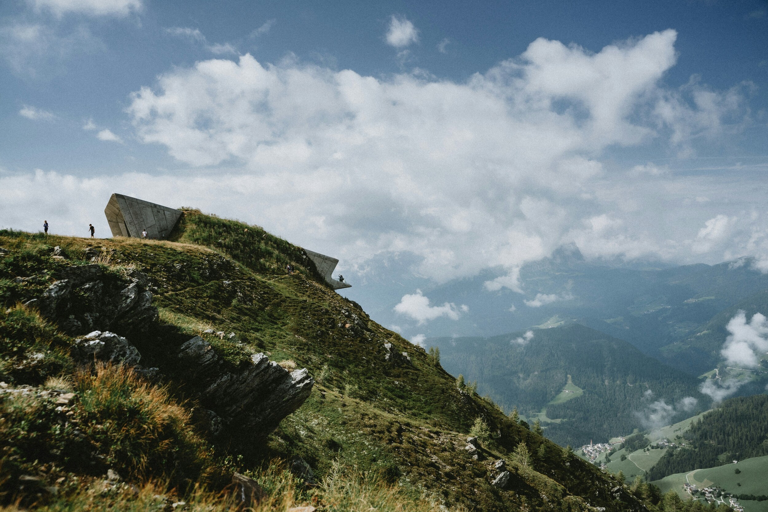 Futuristic concrete building on a mountainside