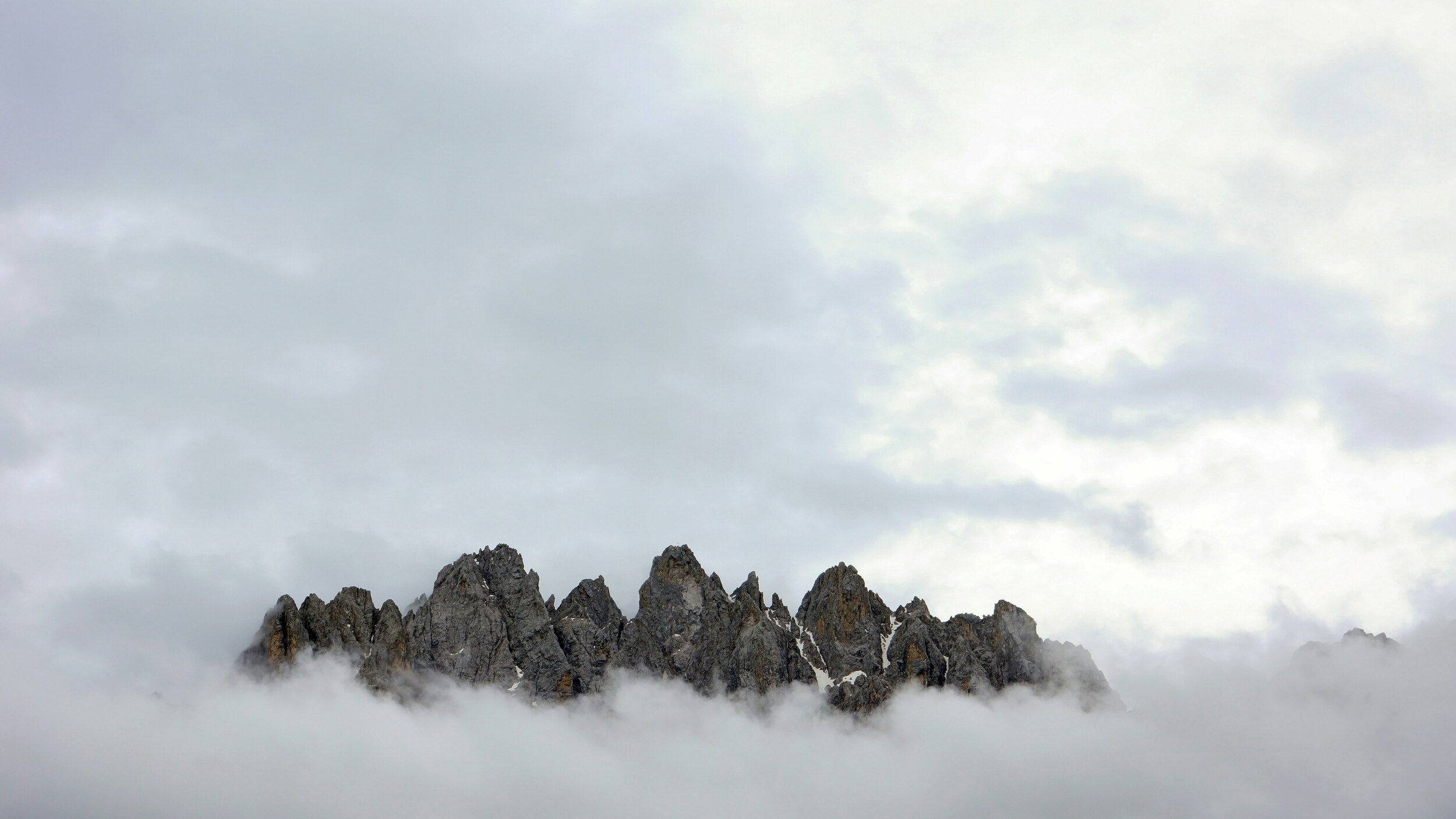 Rugged peaks emerging from the clouds