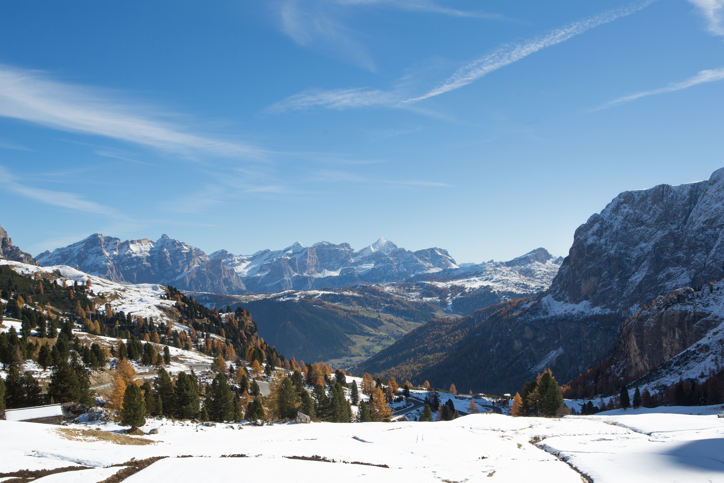 Partly snow-covered mountain and forest landscape