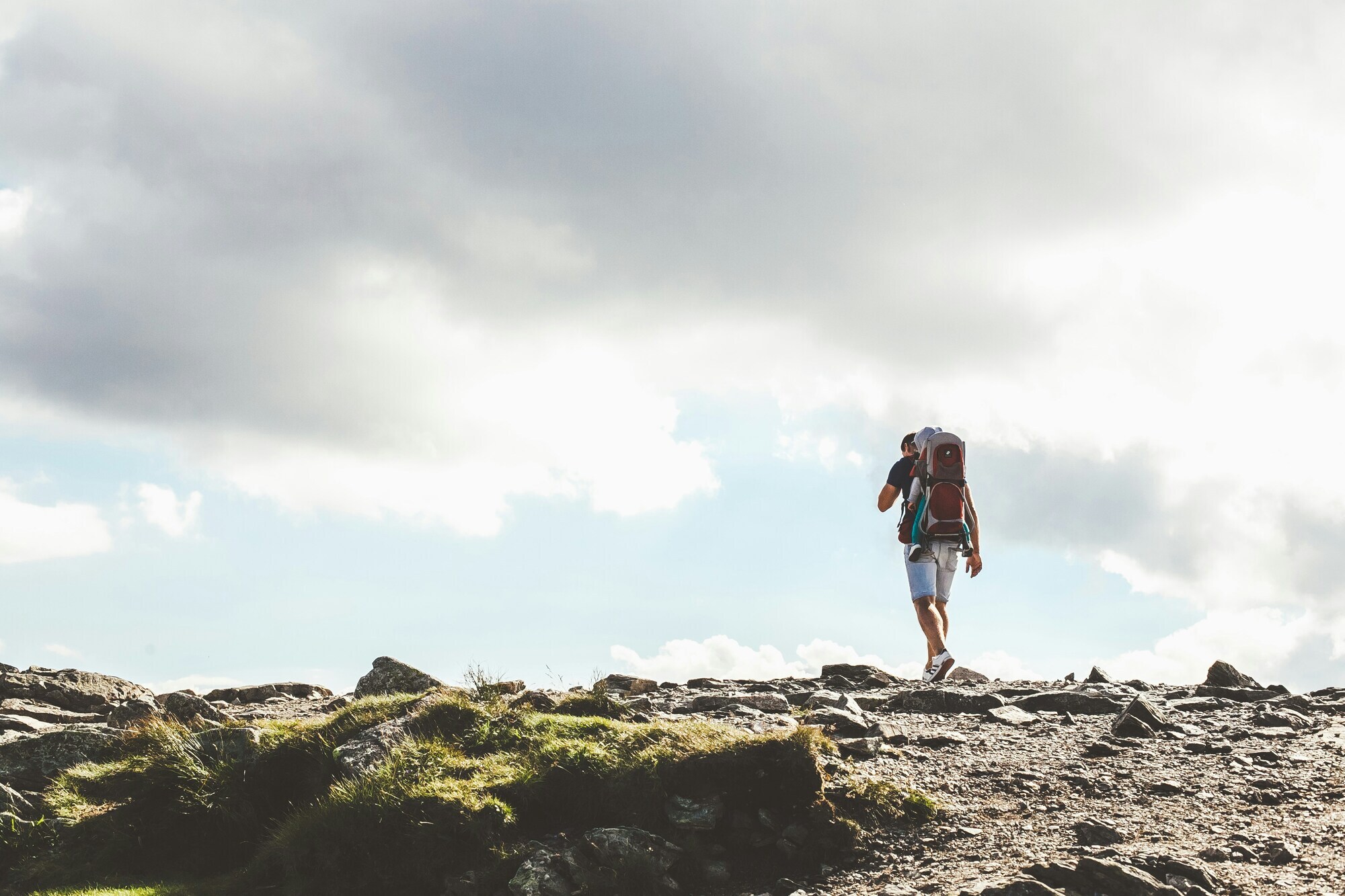 Hiker with backpack on a rocky terrain