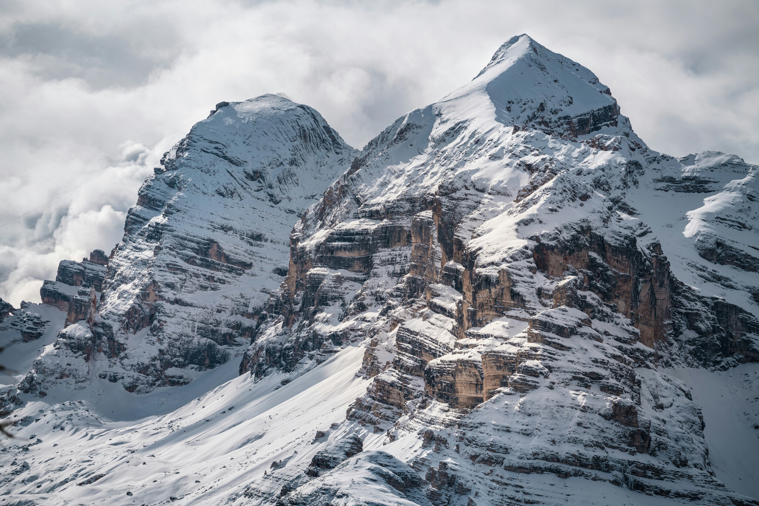 Snow-covered mountain peaks with steep slopes