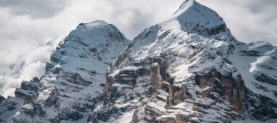 Snow-covered mountain peaks with steep slopes